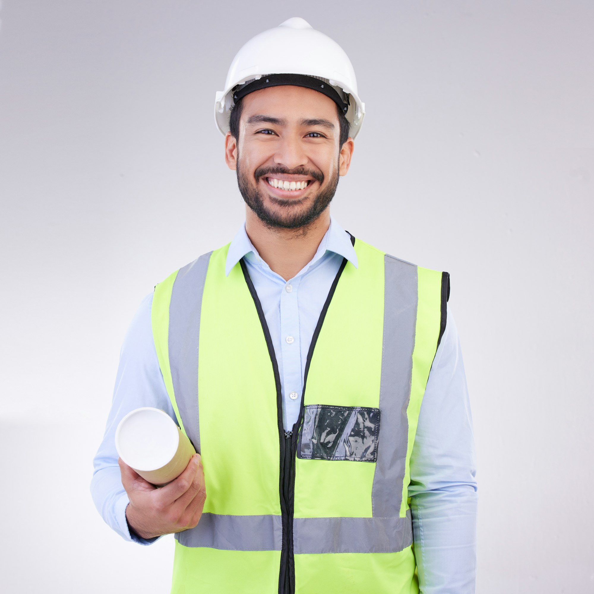 Construction worker man in portrait isolated on a white background engineering, architecture and de